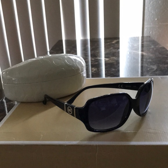 MK sunglasses with large Coach case